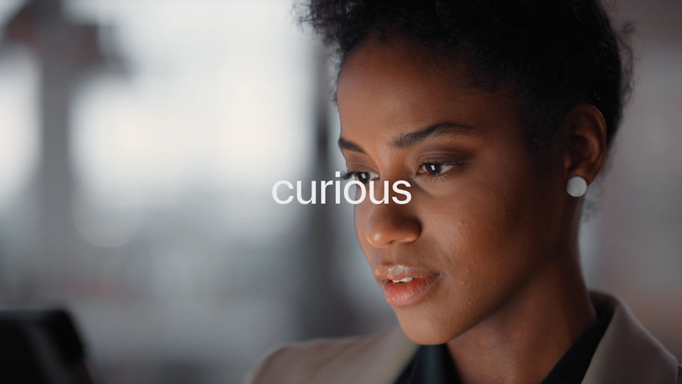 Professional reviewing information on a screen, representing thoughtful analysis, trust, and data-driven decision-making